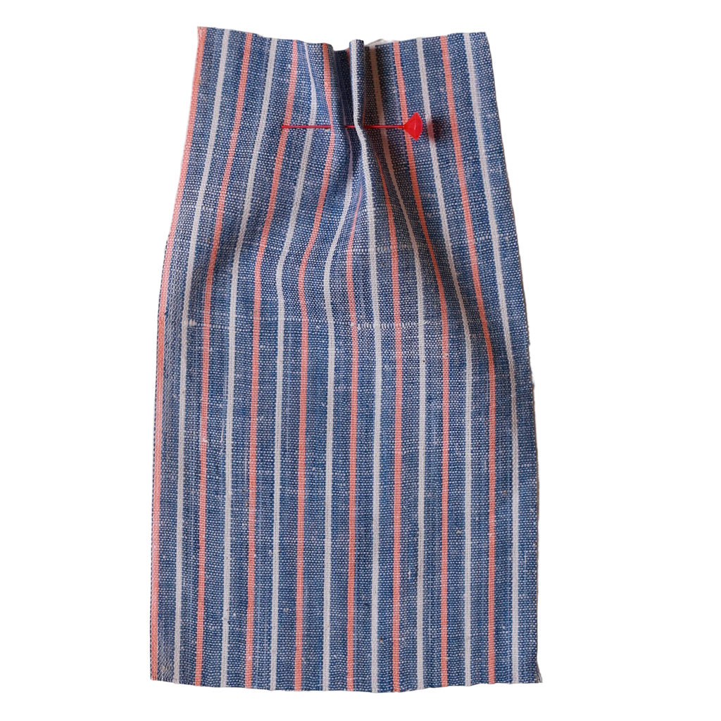 Handwoven Striped fabric with blue, red, and white lines on a beige background. Fabric collection ATELIER A.PUUR.A