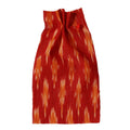 Red and orange patterned fabric on a beige background, ikat collection ATELIER A.PUUR.A 