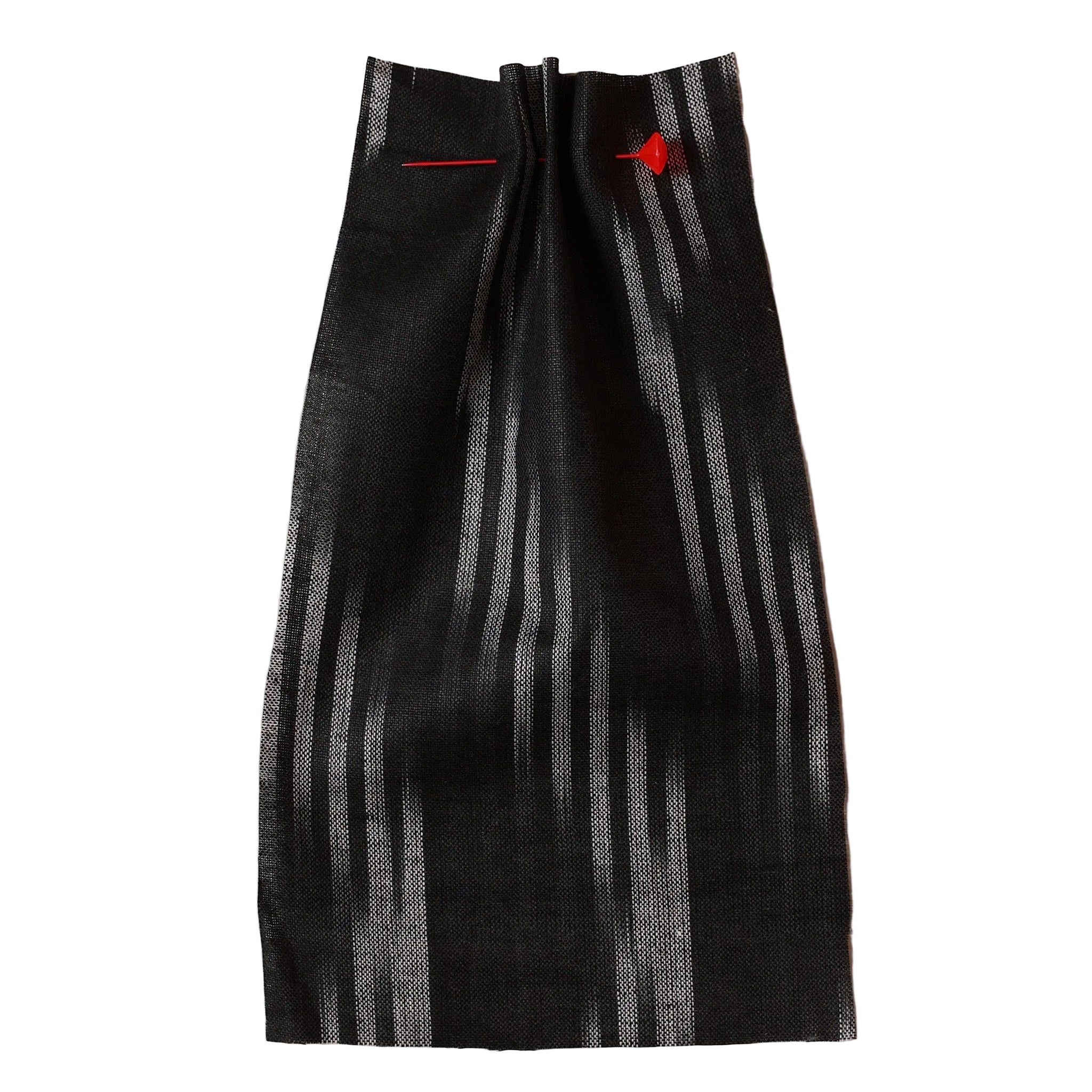 Black and white Ikat striped fabric with red accents on a beige background. Fabric collection ATELIER A.PUUR.A
