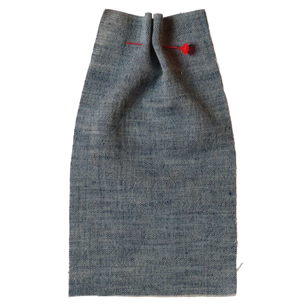 Indigo fabric with a red pin on a beige background, collection ATELIER A.PUUR.A 