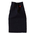 Dark indigo blue fabric with a red needle on a beige background. Collection ATELIER A.PUUR.A