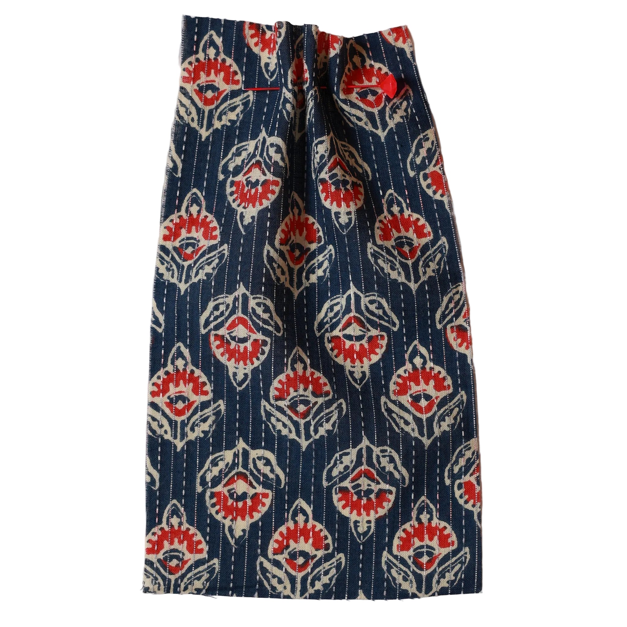 Printed fabric with a blue, red, and white pattern on a beige background. Fabric collection ATELIER A.PUUR.A 