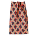 Printed Fabric with orange, red and blue pattern on a beige background. Fabric collection ATELIER A.PUUR.A 