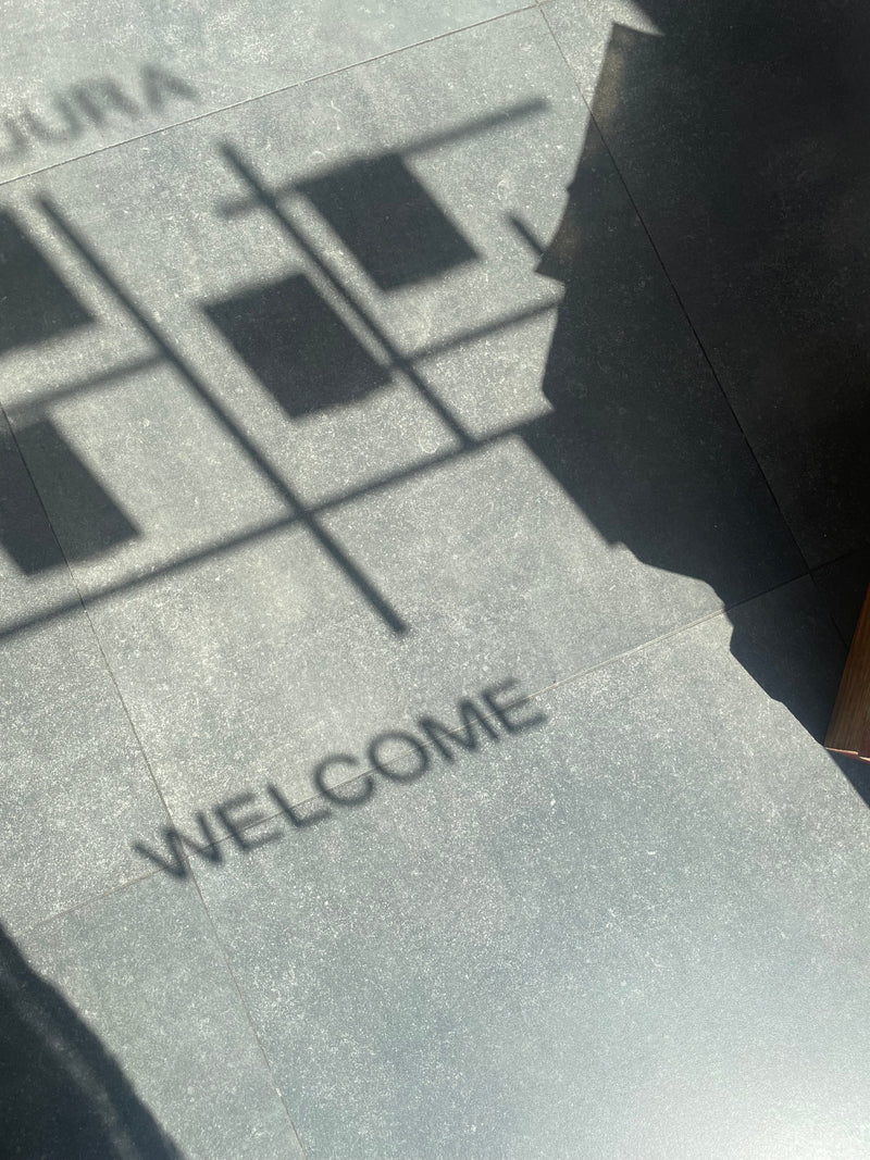 Welcome sign on the window of ATELIER A.PUUR.A shop opening Antwerp 